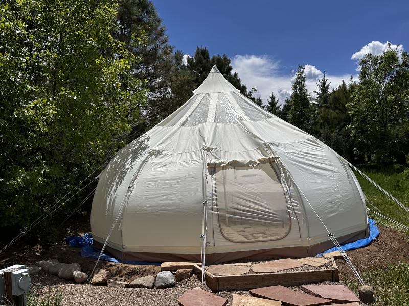 canvas tent needs to be patched. currently set up and ripped.